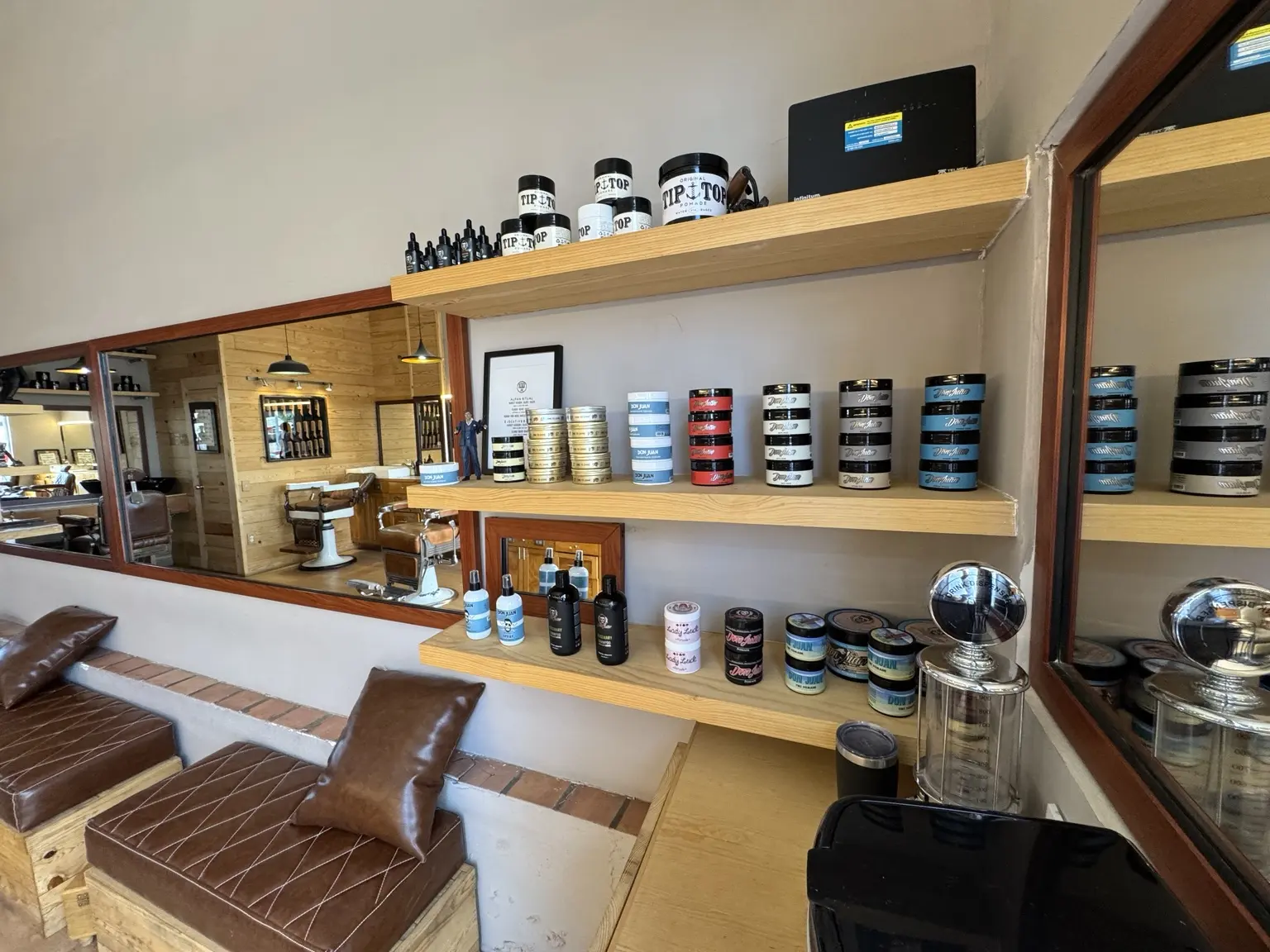 Professional products displayed inside Alpha Barber